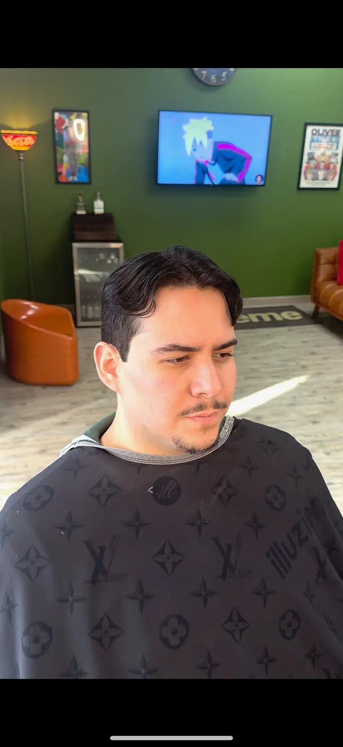 Classic side part cut at One For All Barbershop