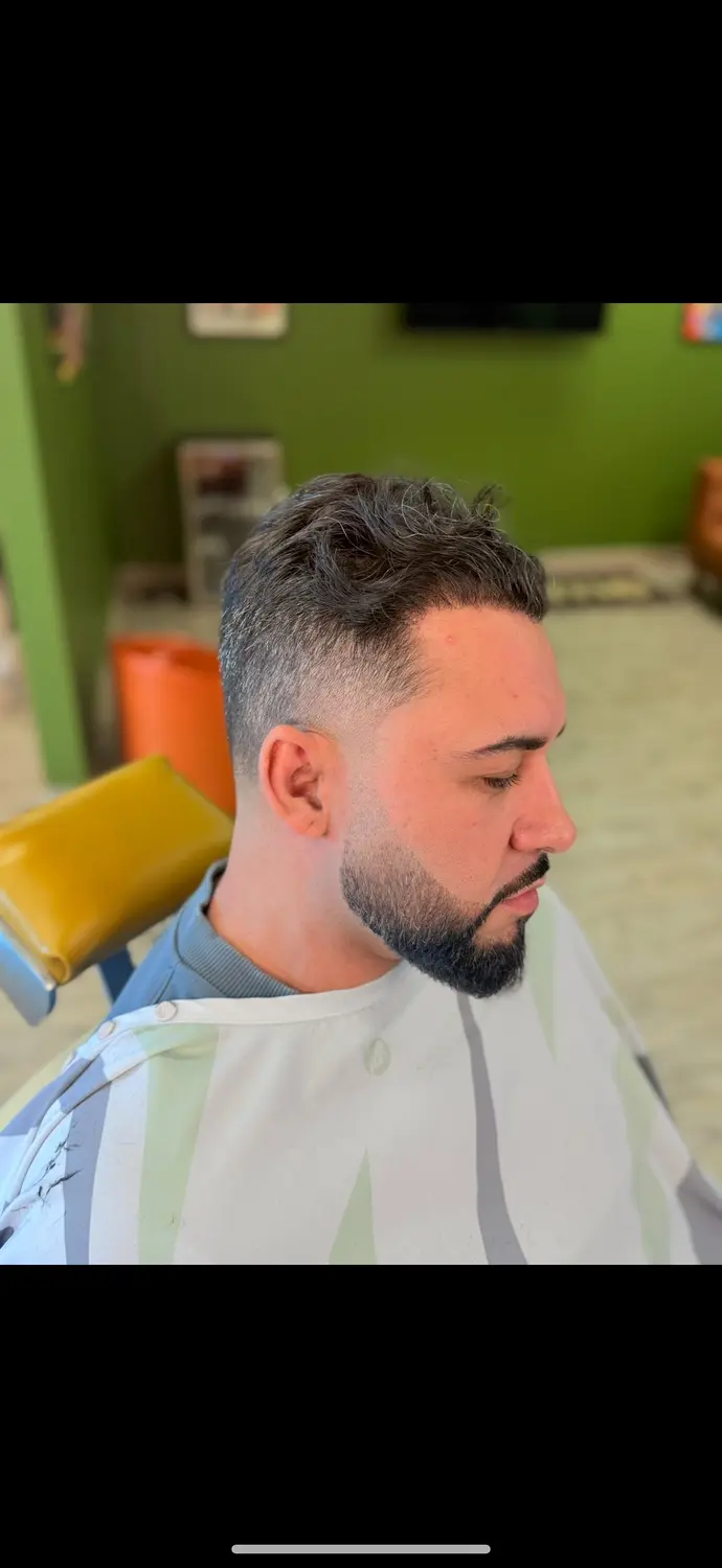 Textured cut with fade at One For All Barbershop
