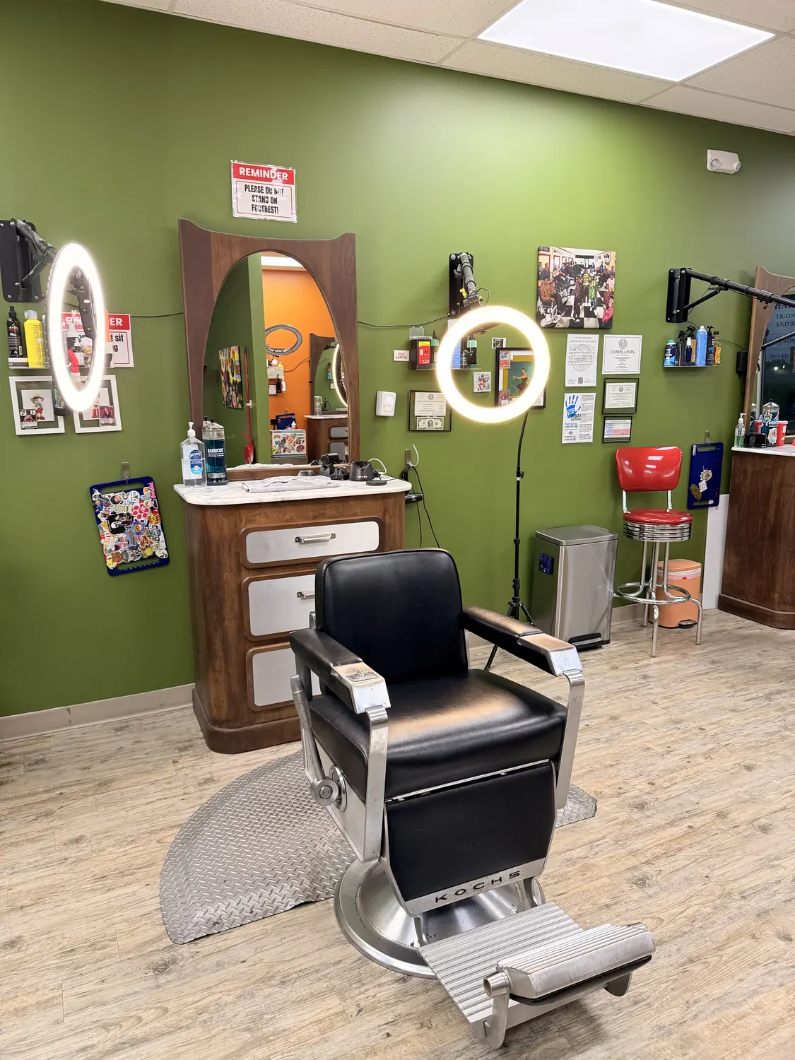 Barber chair and workstation at One For All Barbershop